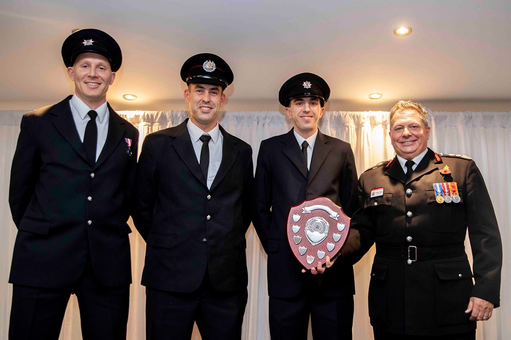 Crew members with award for working together to improve availability at Towcester Fire Station