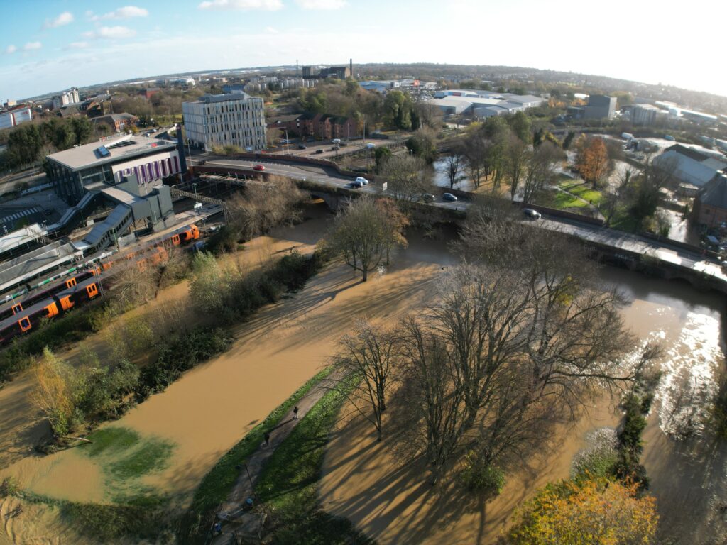 Drone image showing flooded area and river