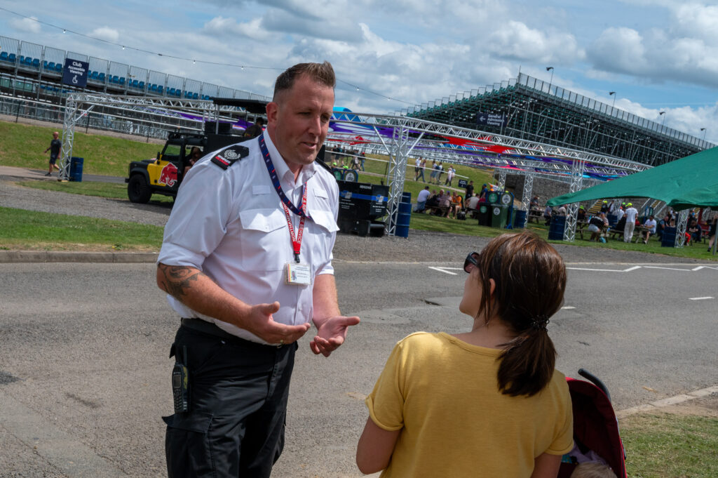 JOT Manager Matt Butler speaks to a member of the public at Silverstone 